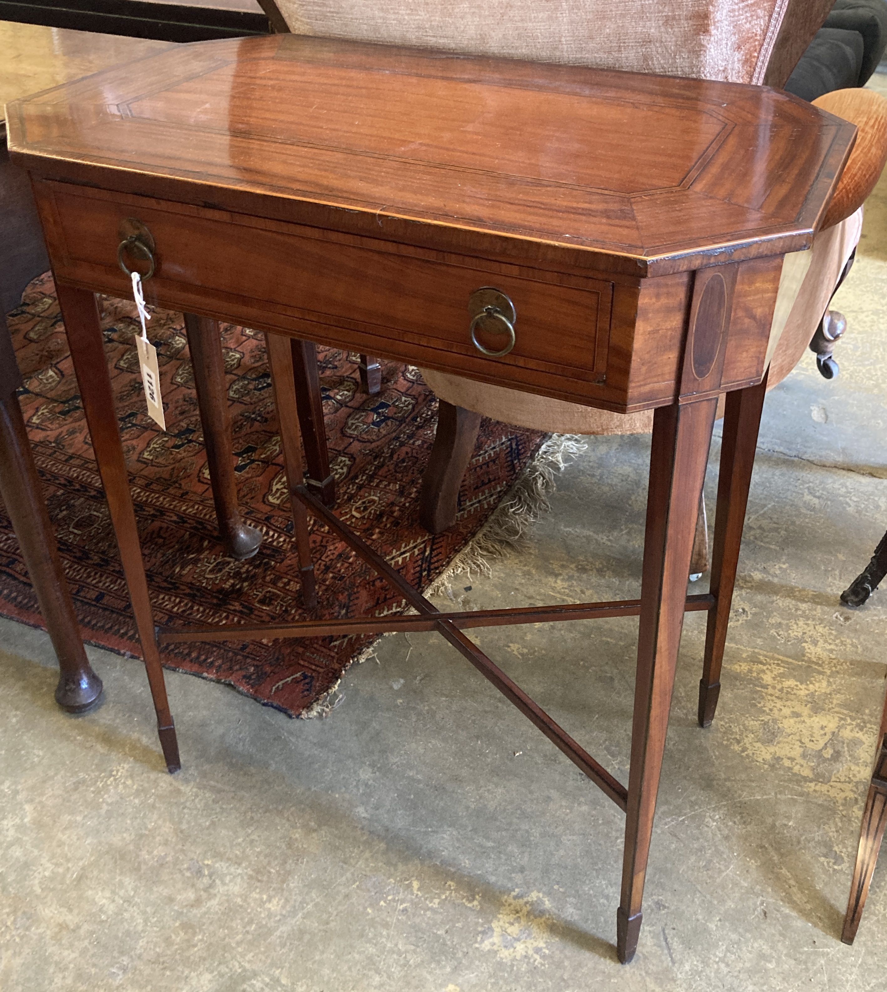 A George III Sheraton style inlaid mahogany side table of canted rectangular form, width 62cm, depth 37cm, height 75cm